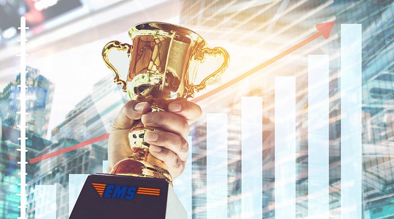 Trophy with growth graphics behind